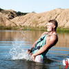 Hot nude guy splashing in the water