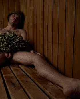 Naked guy in sauna steaming his thick uncut dick