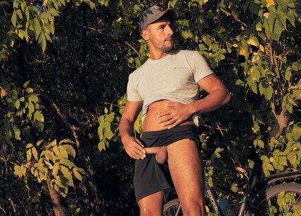 Cyclist jerking in public place meeting the beautiful sunset