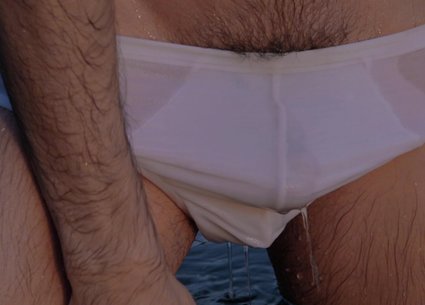 Sexy man bathing in gay white underwear