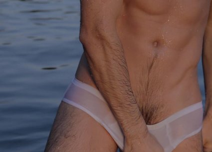 Sexy man bathing in gay white underwear